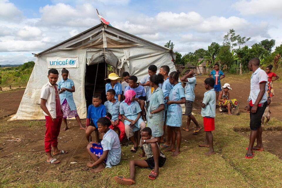 Children attend school in a tent provided by UNICEF after their school was destroyed by Tropical Cyclone Freddy in Eastern Madagascar. 