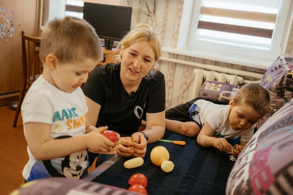 Tetiana plays with her 3-year-old twins, Bohdan and Matvii, in Kharkiv, Ukraine on May 25, 2024.