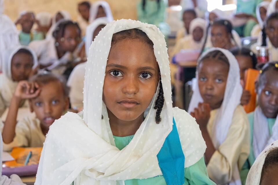 Displaced by conflict in Sudan, Wisam, 9, and her siblings are back in school with support from UNICEF in Port Sudan. 