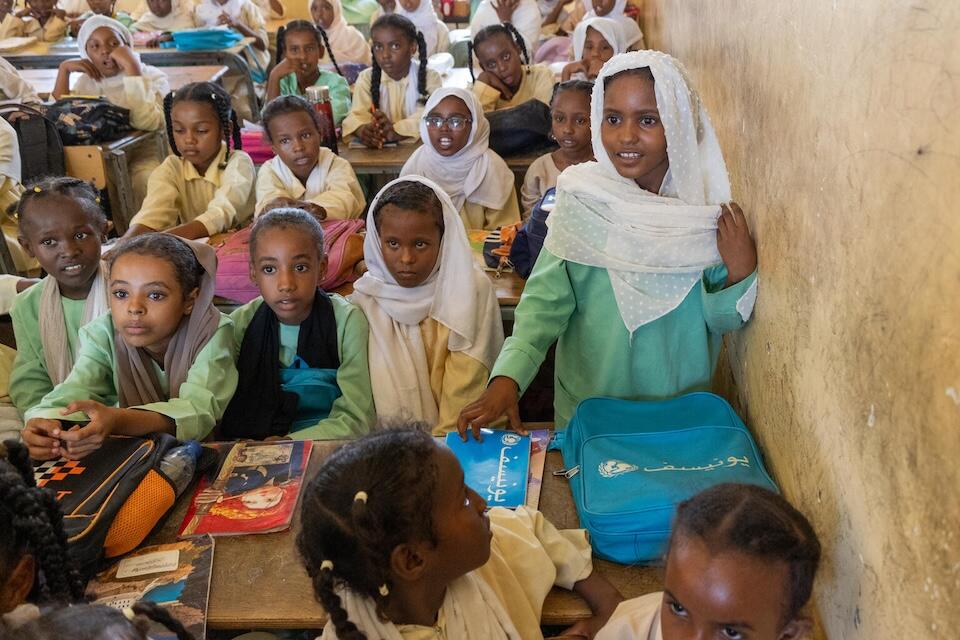 On Oct. 3, 2024, 9-year-old Wisam answers questions during a lesson at UNICEF-supported Salalab Eastern Basic and Primary School for Girls and Boys in Port Sudan.