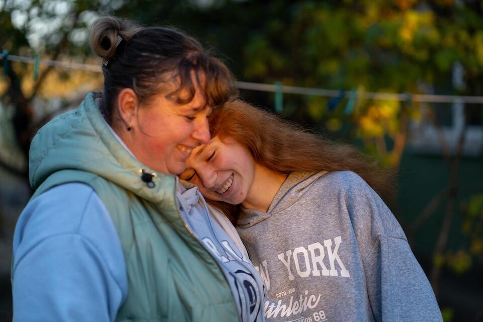 On Oct. 23, 2024, in Khotimlya, Kharkiv region, Katya shares a tender moment with her 14-year-old daughter, Halyna.