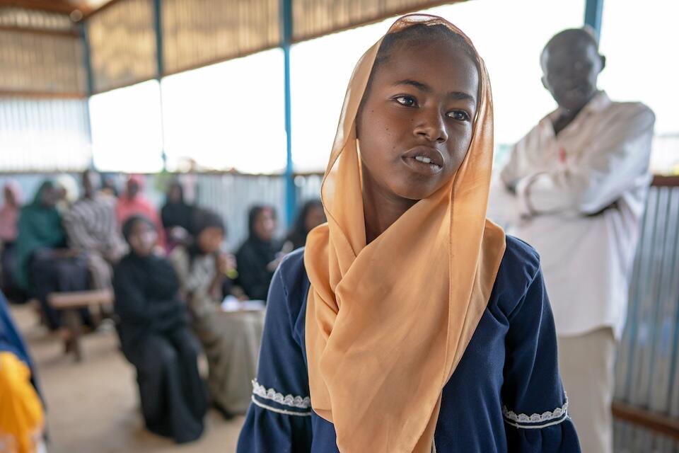 A young girl who fled conflict in Sudan attends a UNICEF-supported school at the Renk Transit Center in South Sudan.