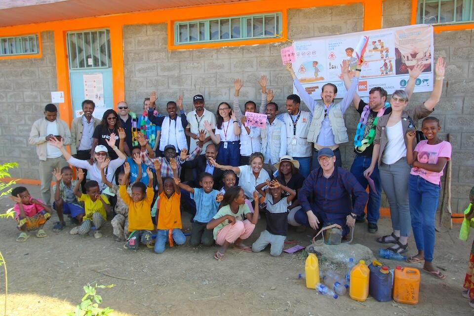 Yasmine Sherif, Executive Director of Education Cannot Wait (ECW), other representatives from ECW and ECW's strategic partners are welcomed by students at the ECW-supported FreKalsi Primary School in the Tigray region of Ethiopia.