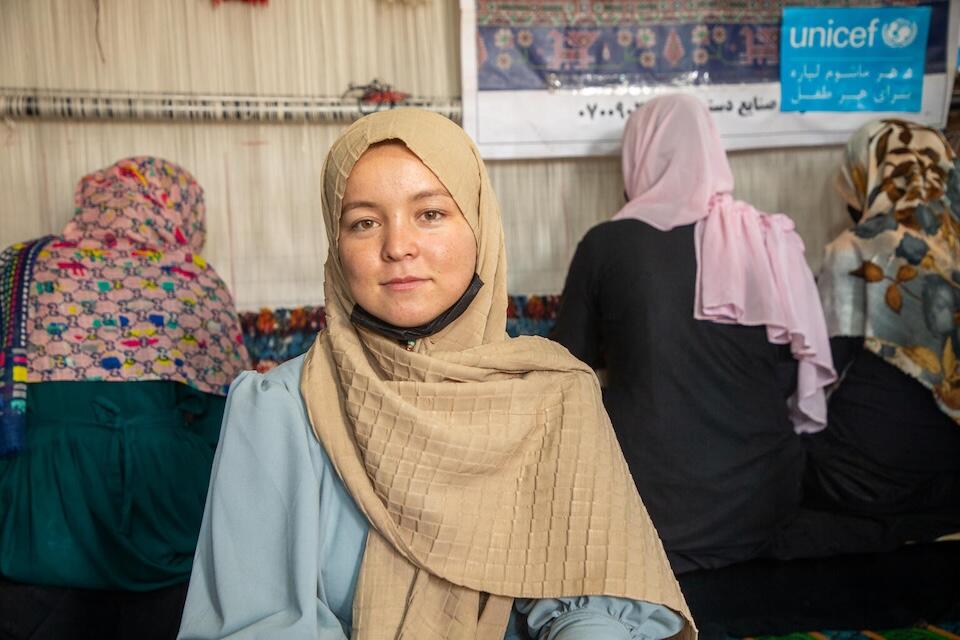 Young women learn carpet weaving in a vocation skills program supported by UNICEF in Herat, Afghanistan.