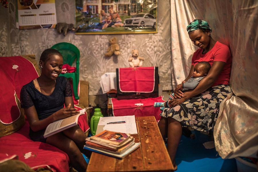 Sandra Achieng and her mom Winnie at their home in Kibera. The Kenya government gave directives that all school to be closed to curb the spread of the COVID-19 pandemic, Sandra always gets revision assignments from her classteacher via her father's smartp