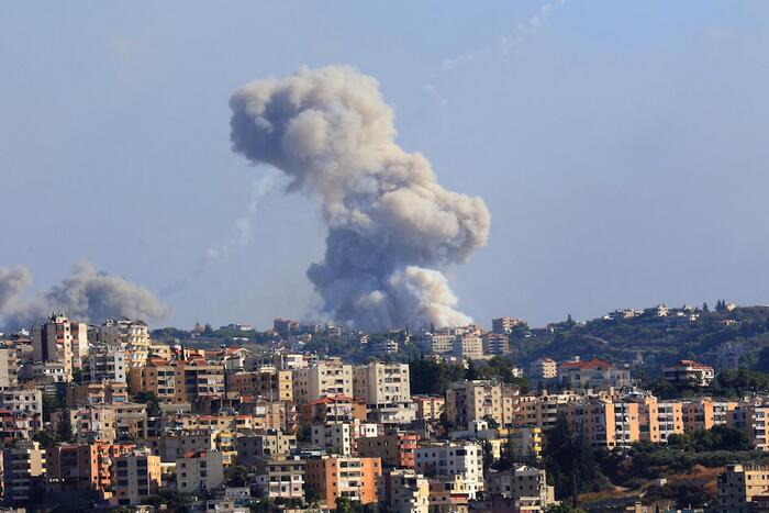 Smoke billows from a site targeted by shelling in the southern Lebanese village of Zaita on Sept. 23, 2024.