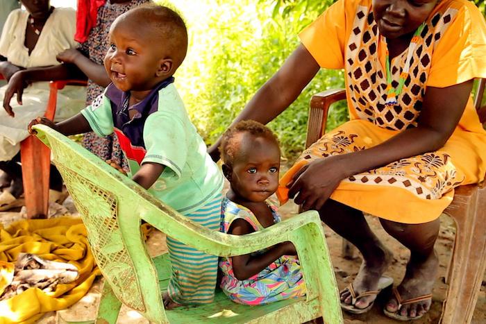 After eight weeks of UNICEF-supported treatment for severe acute malnutrition, 10-month-old Akot (left) and 16-month-old Adut are thriving in Aweil, South Sudan. 