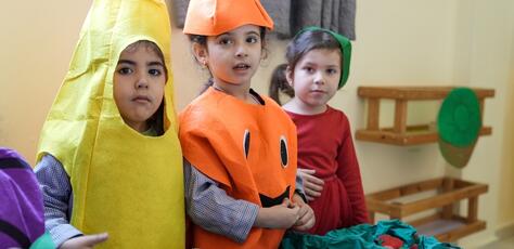 Young children learn about good nutrition at a UNICEF-supported learning space in Lebanon.