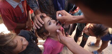 Children receive polio vaccines at a health clinic in Khan Younis, southern Gaza Strip, in September 2024. 