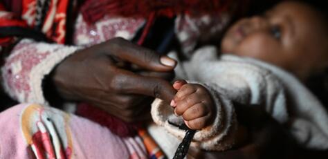 An 18-year-old mother, who was raped by a man who later disappeared, with her 4-month-old daughter at a UNICEF-supported IDP site in in the Borena zone, Oromia region, southern Ethiopia.