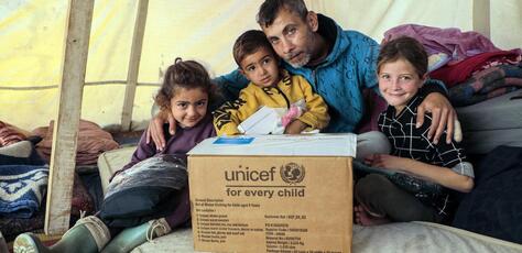 UNICEF and partners bring warmth to children in Khan Younis, Gaza Strip by distributing winter clothes to families in Algeria Camp and Al Amal Camp.